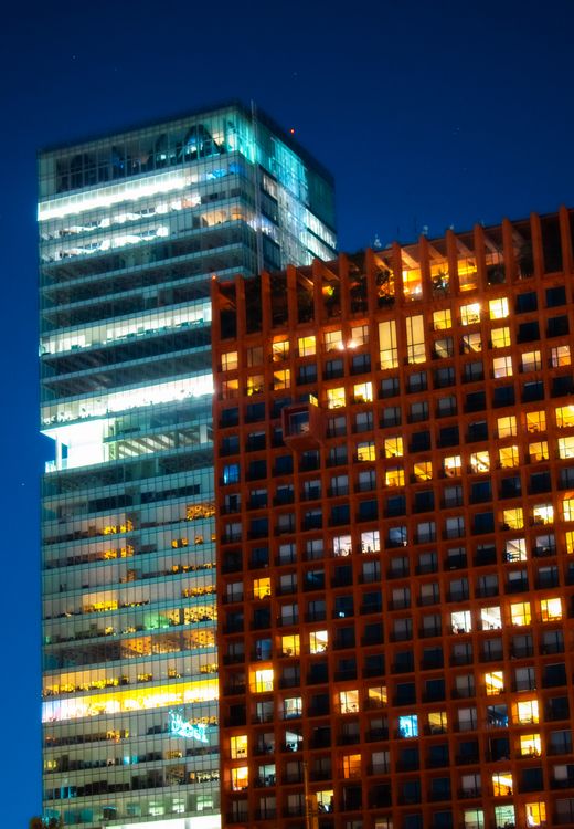 Illuminated financial district skyline at night